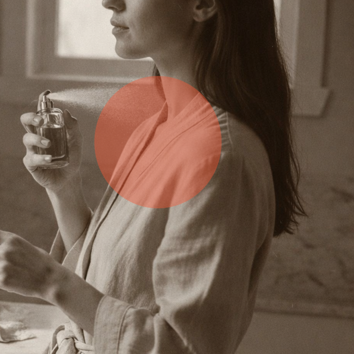 Woman that ruins her expensive dress with fragrance oils by spraying perfume on it.